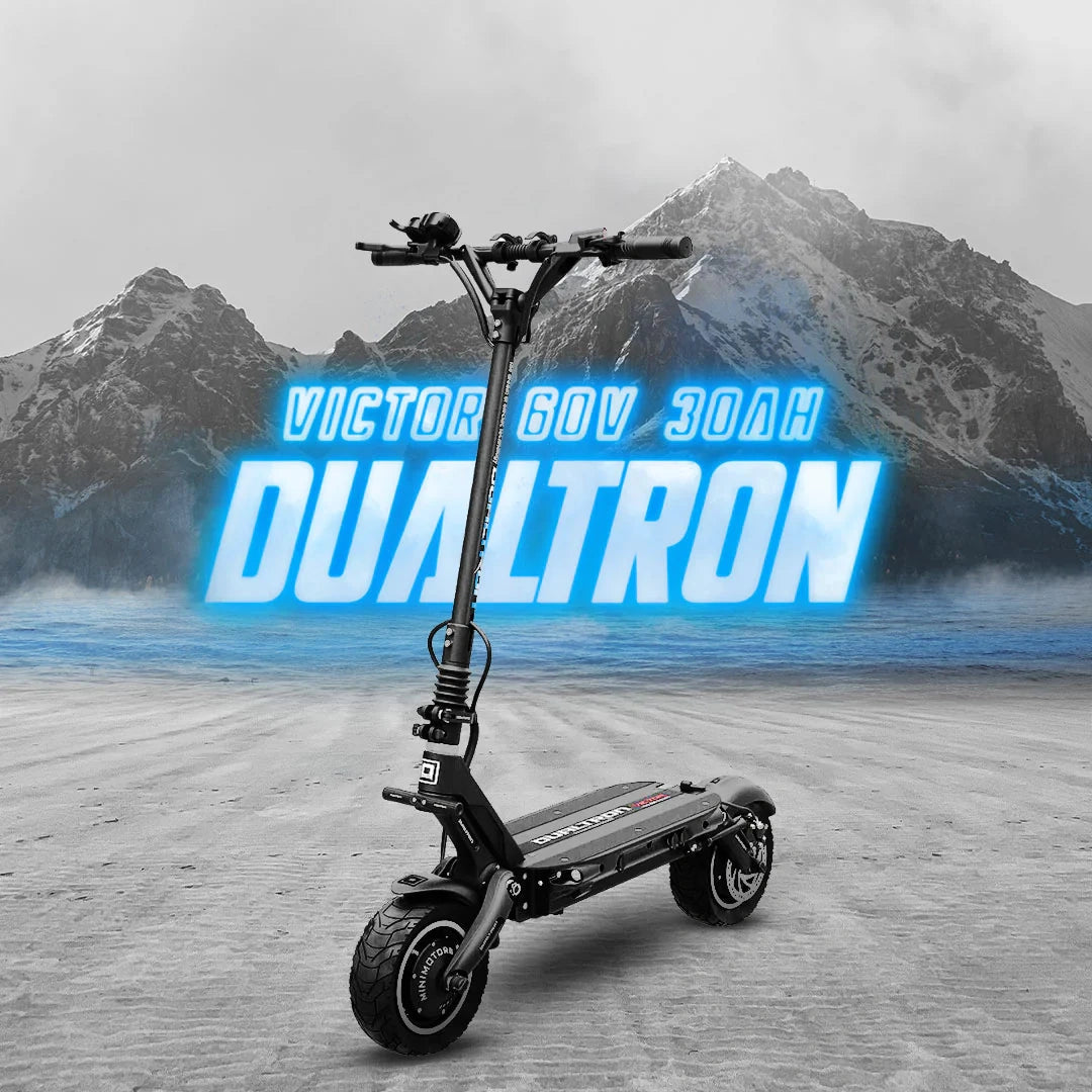 Electric scooter with 'Victor' branding against a mountainous background
