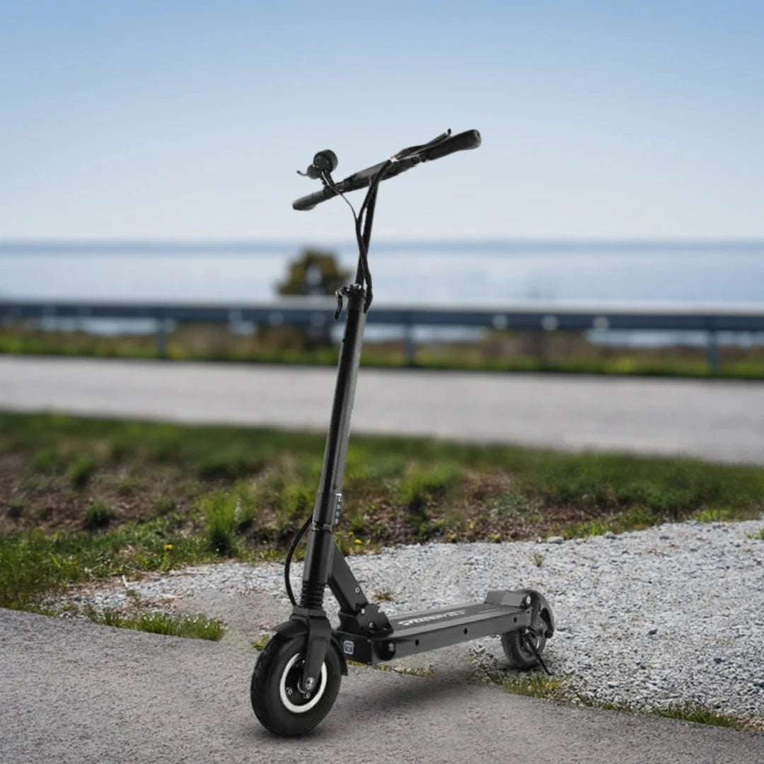 Black electric scooter on a paved road with a blurred background