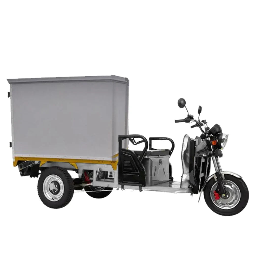 Three-wheeled motor vehicle with a cargo box on a white background