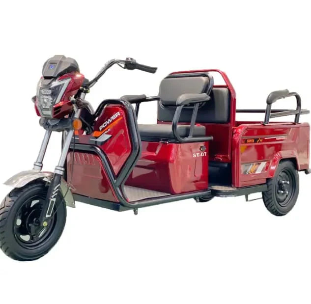 Red electric tricycle with cargo bed on a white background