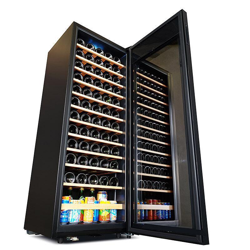 Black wine and beverage cooler with open doors displaying bottles and cans.