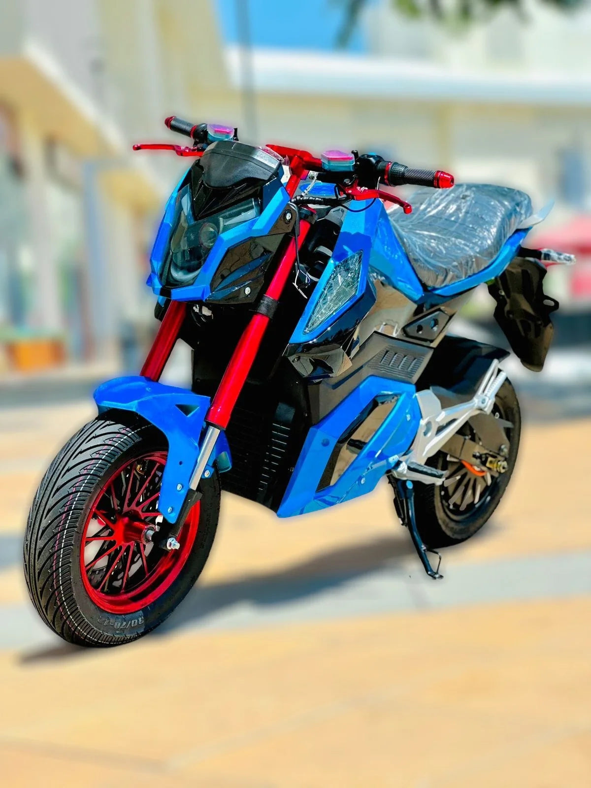 Blue and red motorcycle on a blurred background