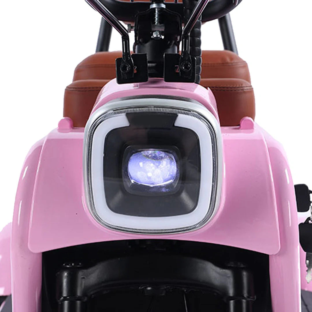 Close-up of a pink children's scooter with a headlight on a white background