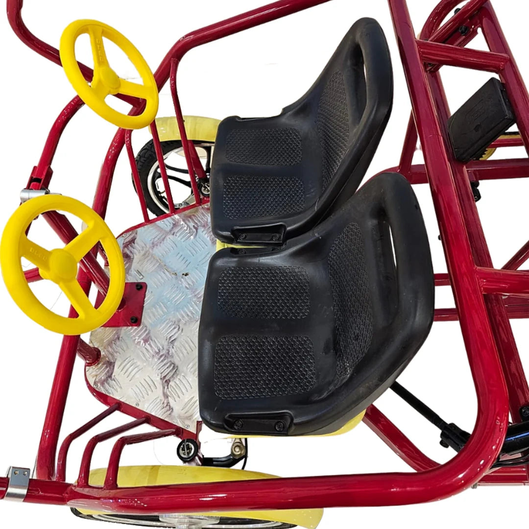 Red pedal car with yellow steering wheels and black seat on a white background
