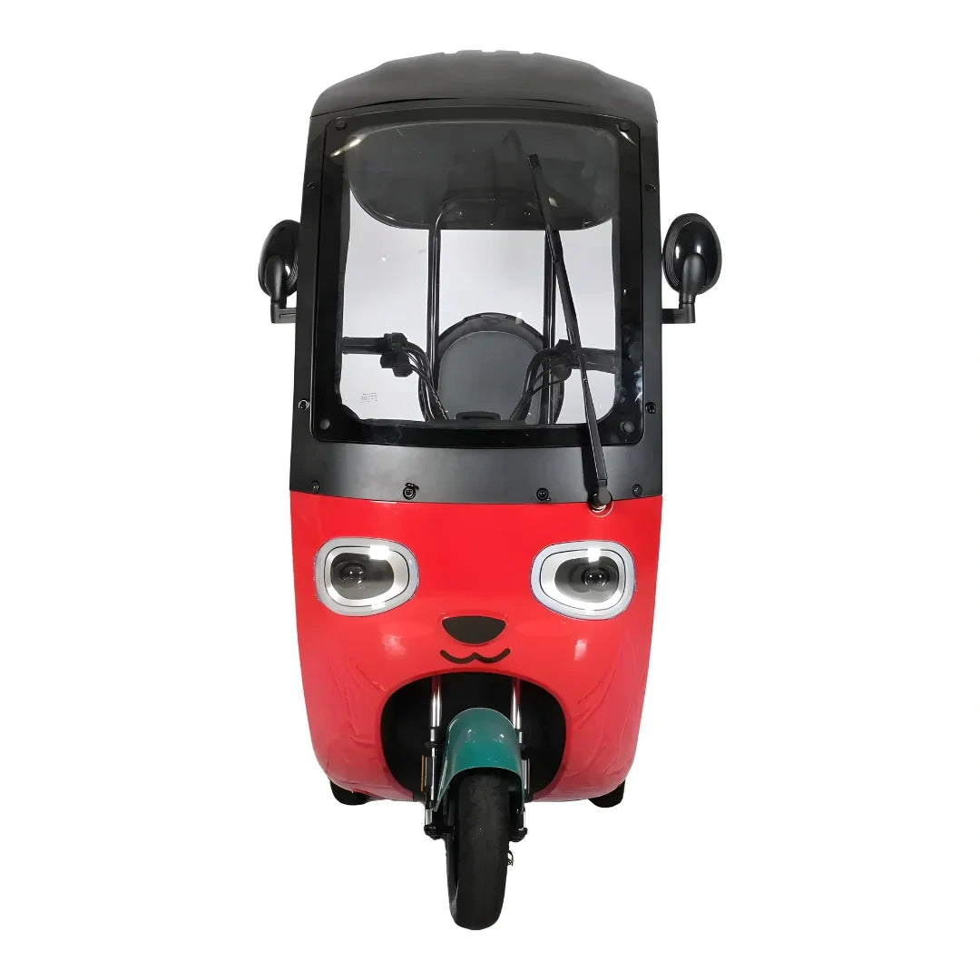 Red and black three-wheeled vehicle with a smiling face design on a white background