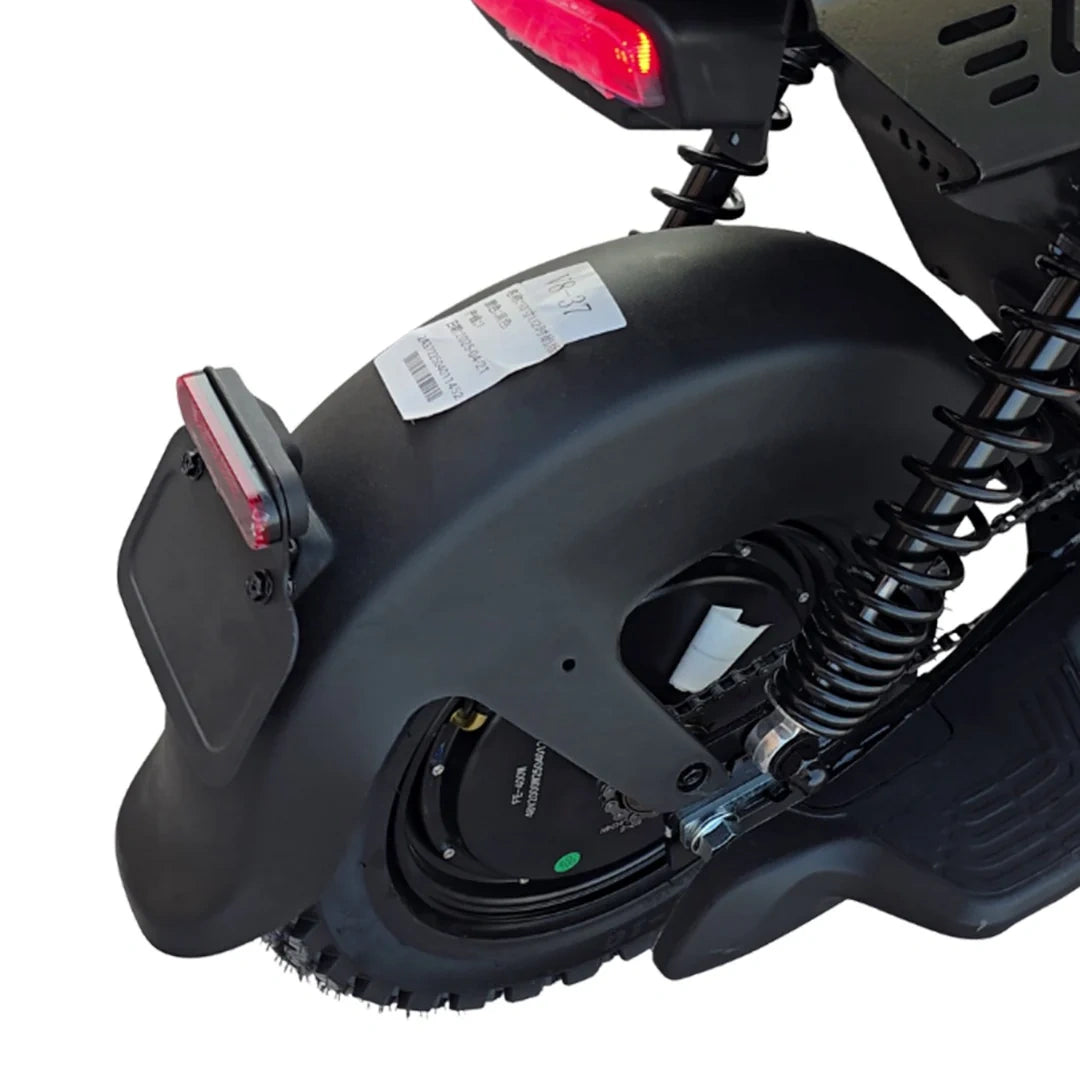 Close-up of a scooter's rear wheel and suspension system on a white background