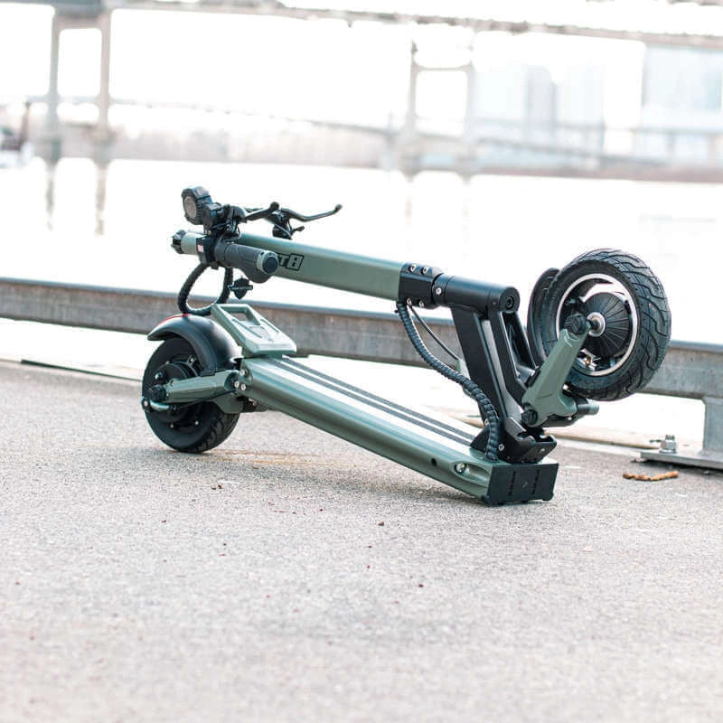 Foldable electric scooter on a concrete surface with blurred background