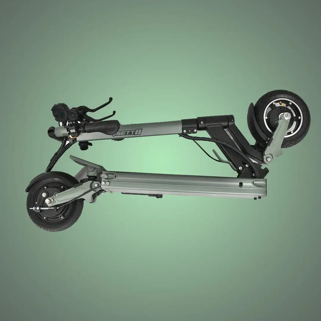 Foldable scooter on a green background