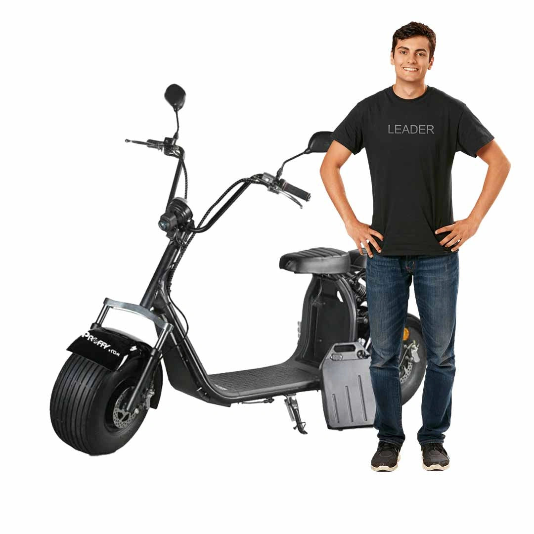 Man standing next to a black electric scooter on a white background