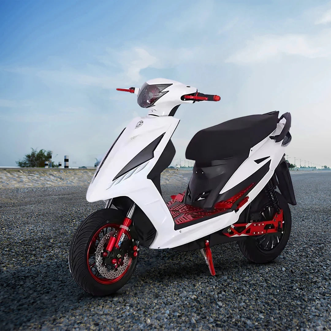White scooter with black and red accents on a road
