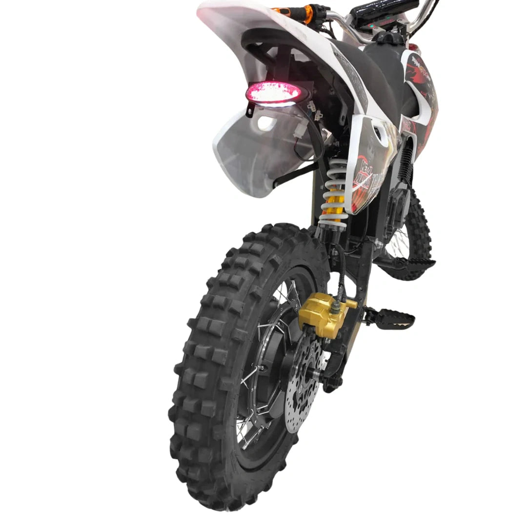 Side view of a dirt bike with prominent tire and suspension details on a white background