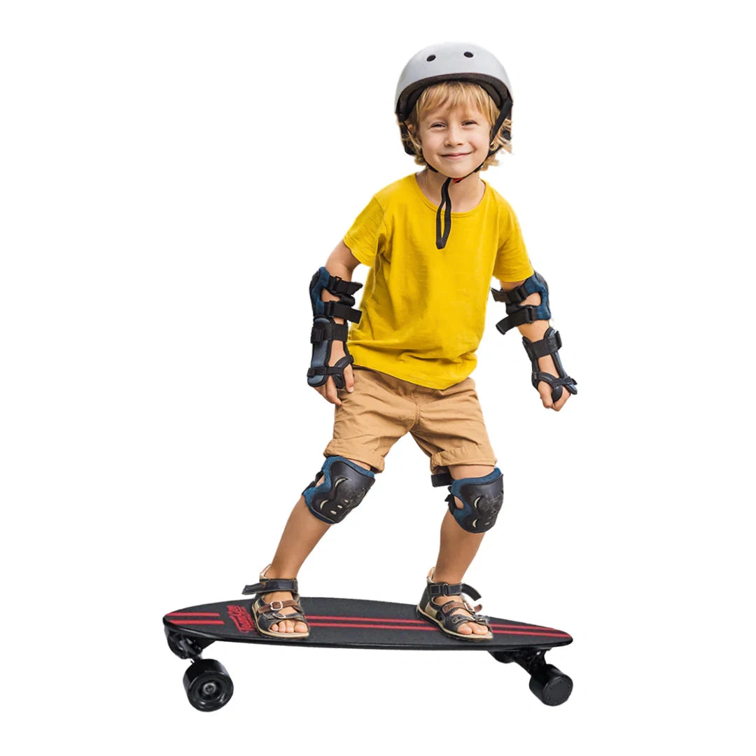 Child wearing protective gear and standing on a skateboard with a white background