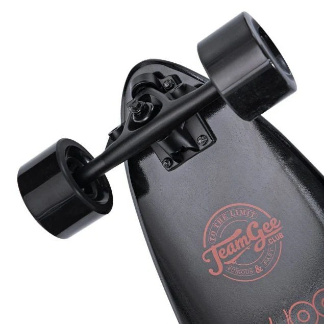 Black skateboard with 'Team Gee' logo on a white background