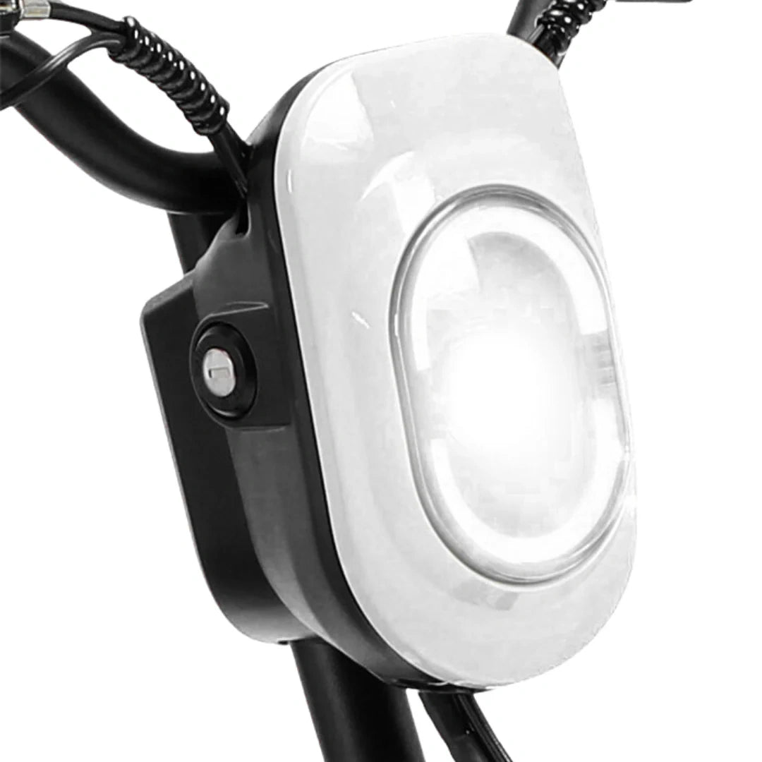 Close-up of a bike light attached to a bicycle frame on a white background