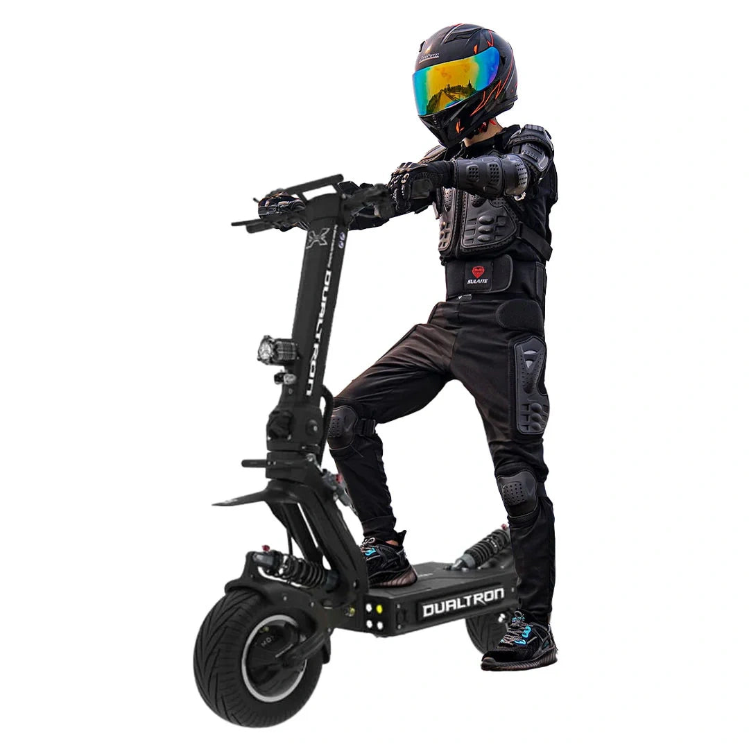 Person in full protective gear riding a Dualtron electric scooter on a white background