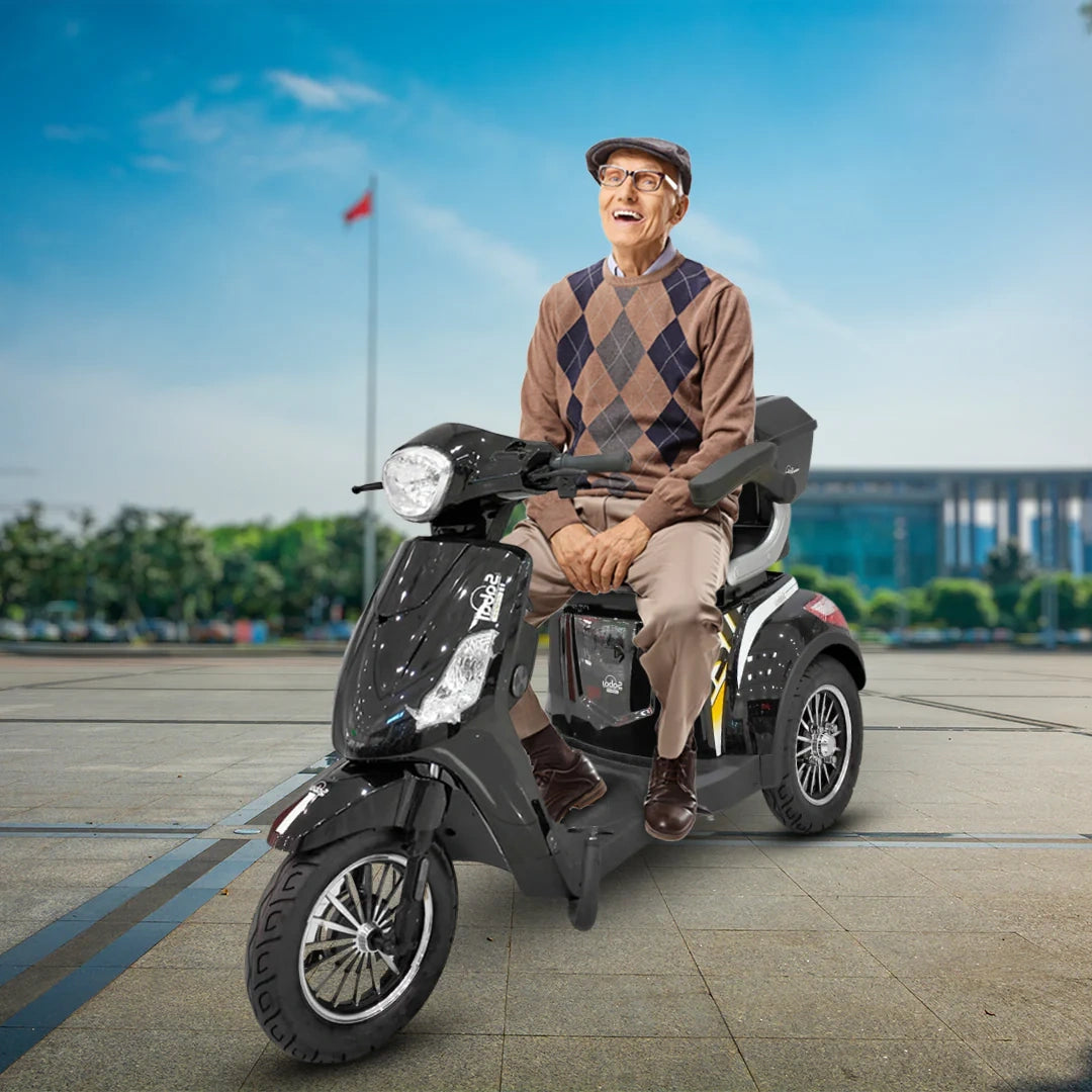 Man sitting on a scooter with a clear blue sky in the background