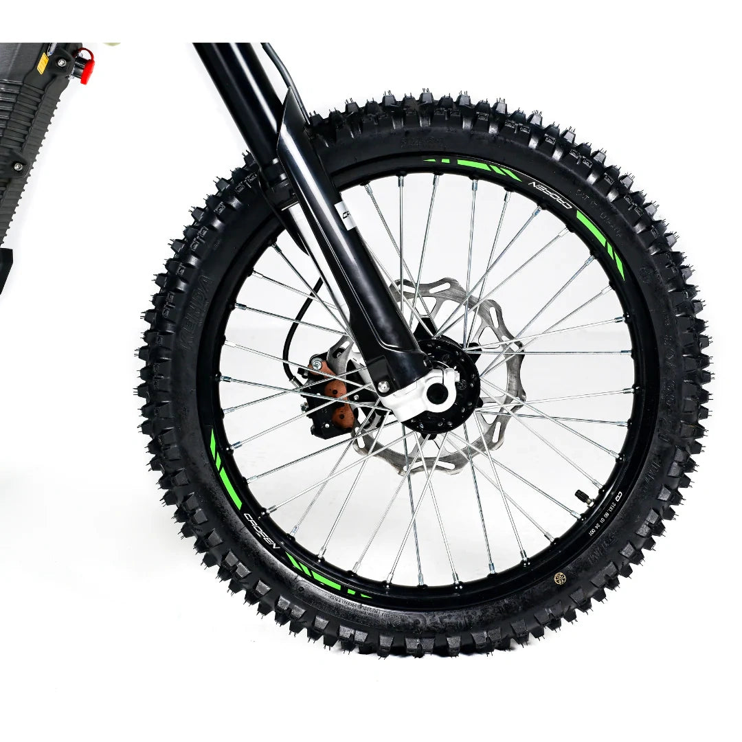 Close-up of a bicycle wheel with knobby tires on a white background