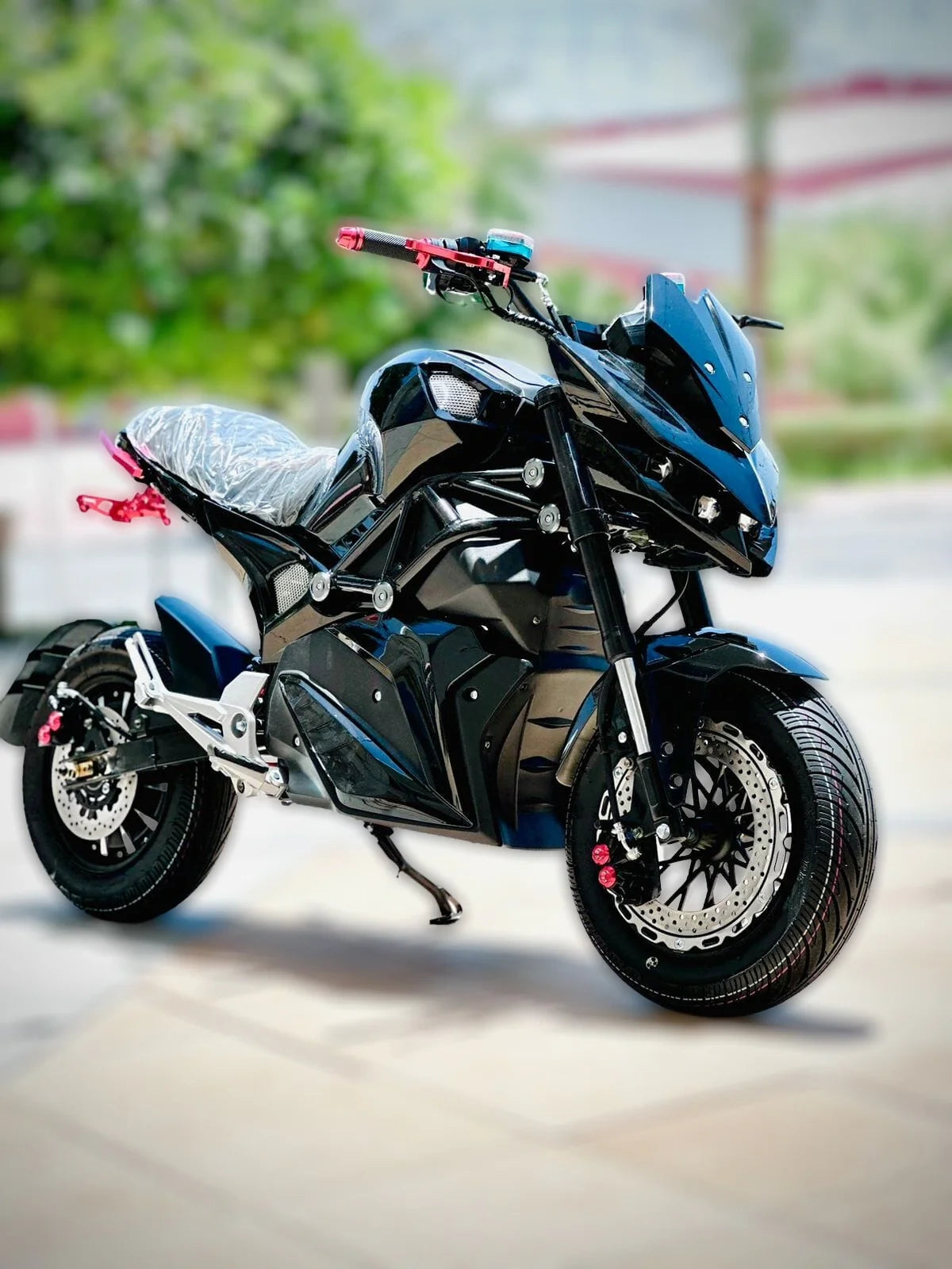 Black and blue electric motorcycle on a blurred background