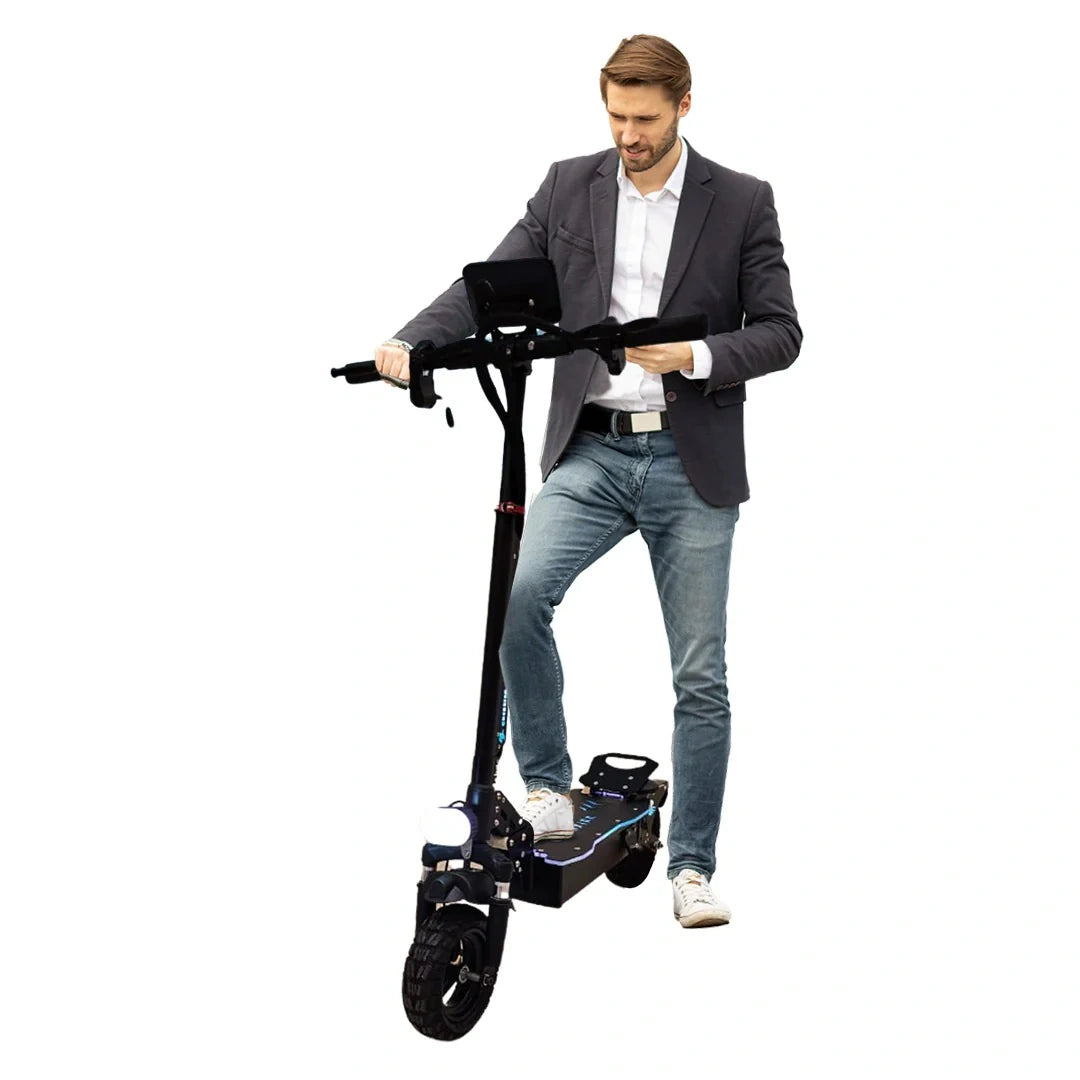 Man in a suit standing next to an electric scooter on a white background