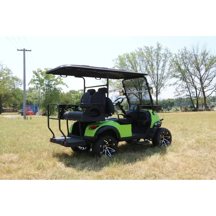 Green golf cart on a grassy field with trees in the background