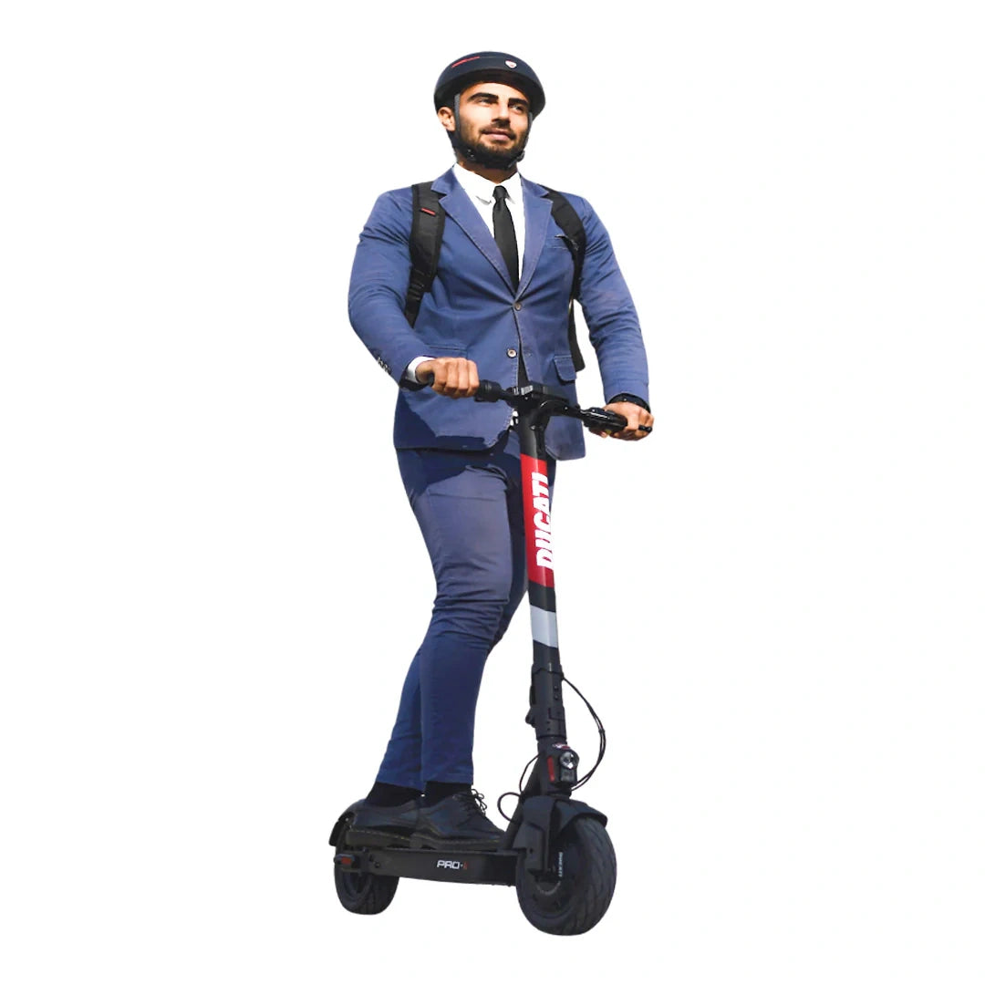 Man in a blue suit riding an electric scooter with 'Dream' branding on a white background