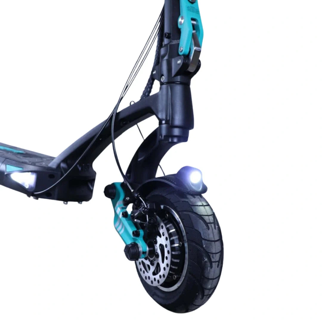 Close-up of a scooter wheel with turquoise frame and black tire on a white background