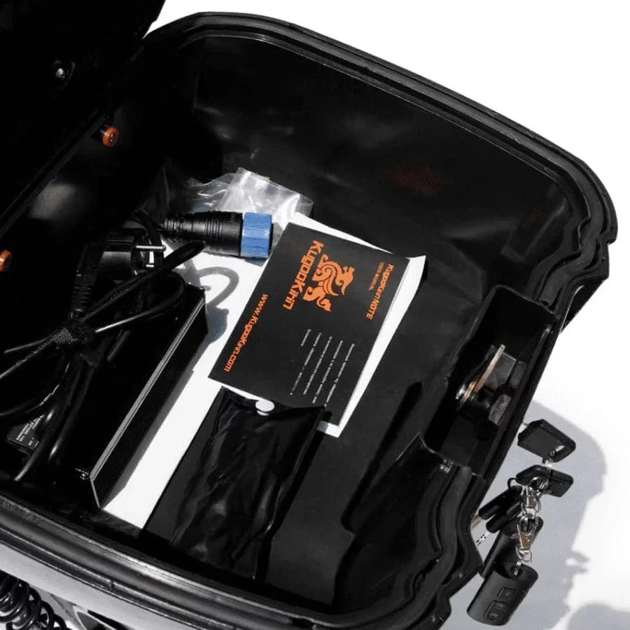 Black suitcase with electronic equipment and a branded box inside