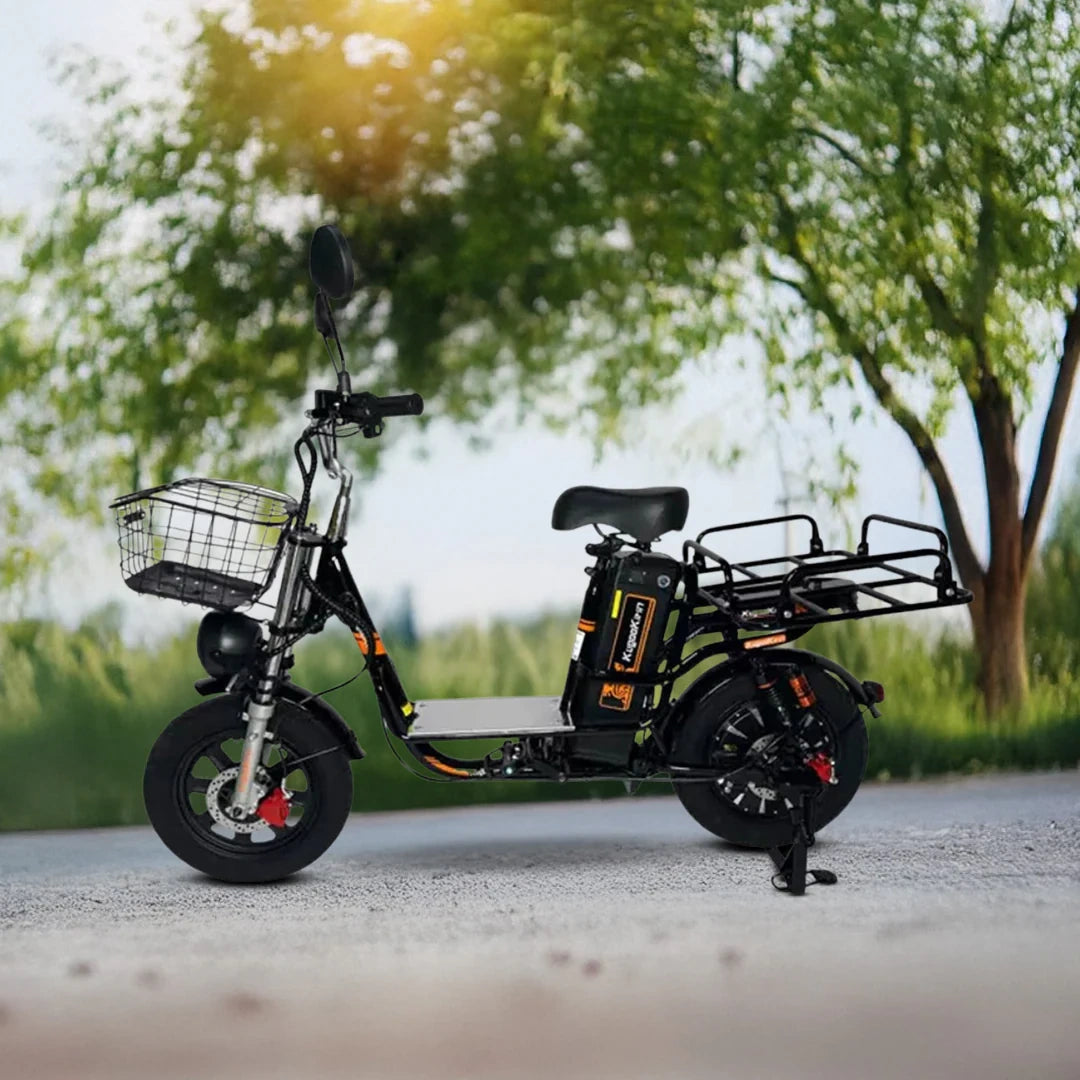 Black electric scooter with a basket on a blurred natural background