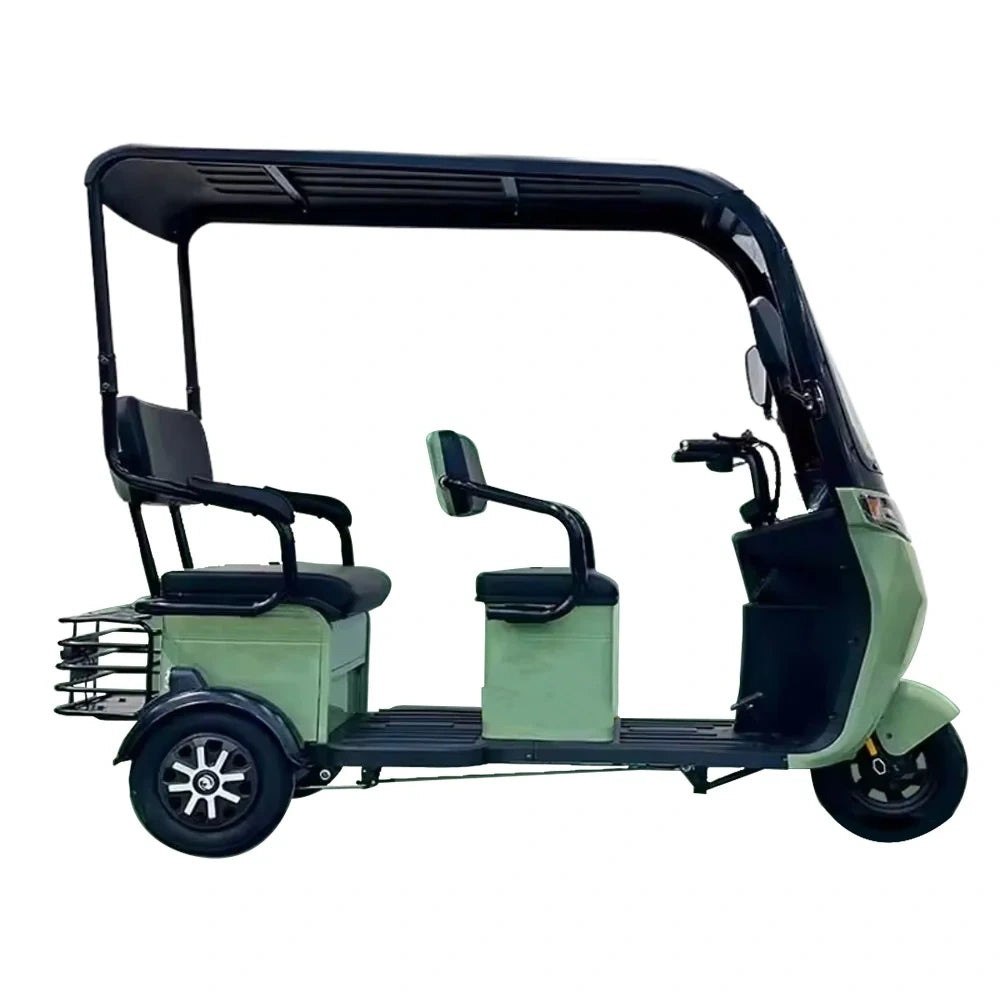 Green and black three-wheeled electric vehicle on a white background