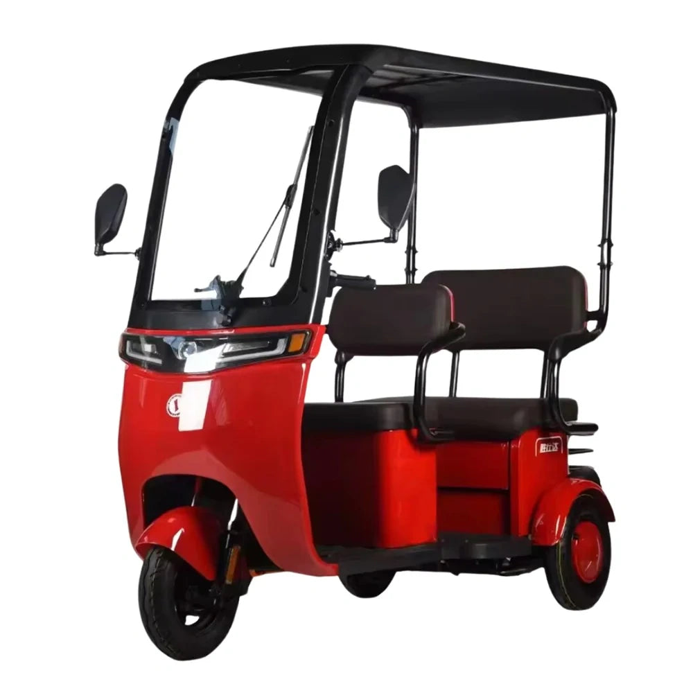 Red three-wheeled vehicle with black canopy on a white background