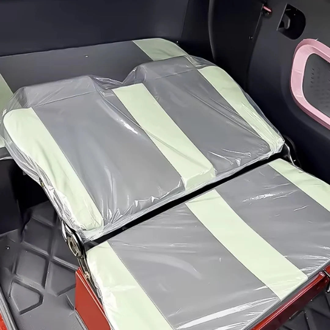 Car seat covers with clear plastic wrap in a vehicle