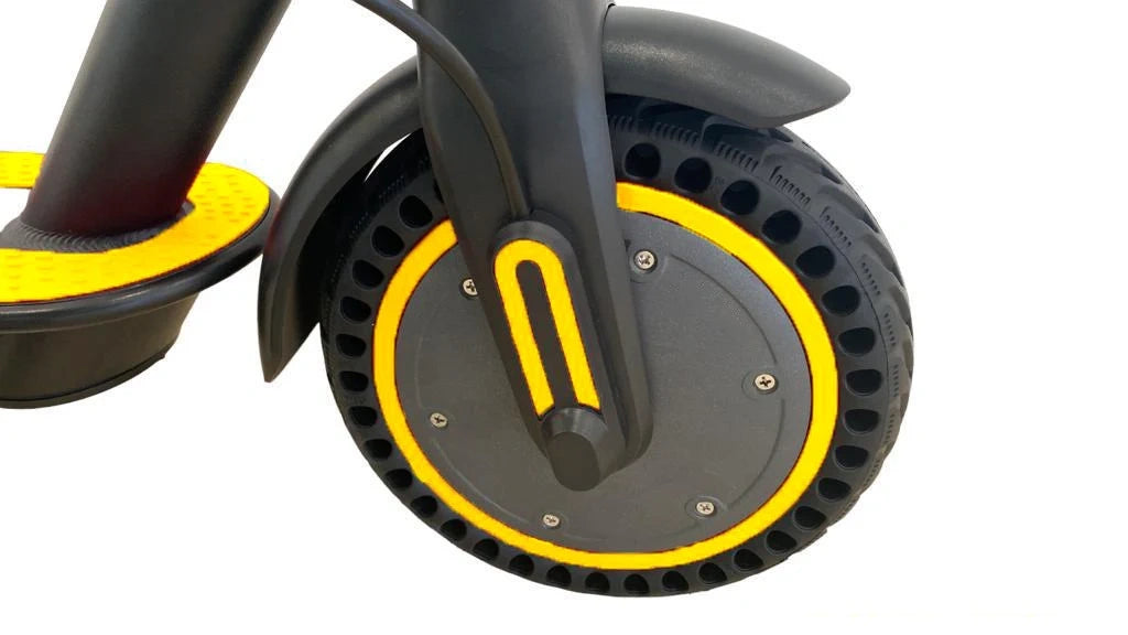 Close-up of a scooter wheel with yellow rim on a white background