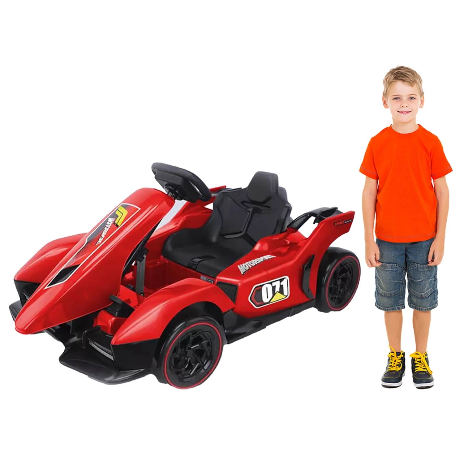 Red toy car with black seats next to a child wearing an orange shirt on a white background