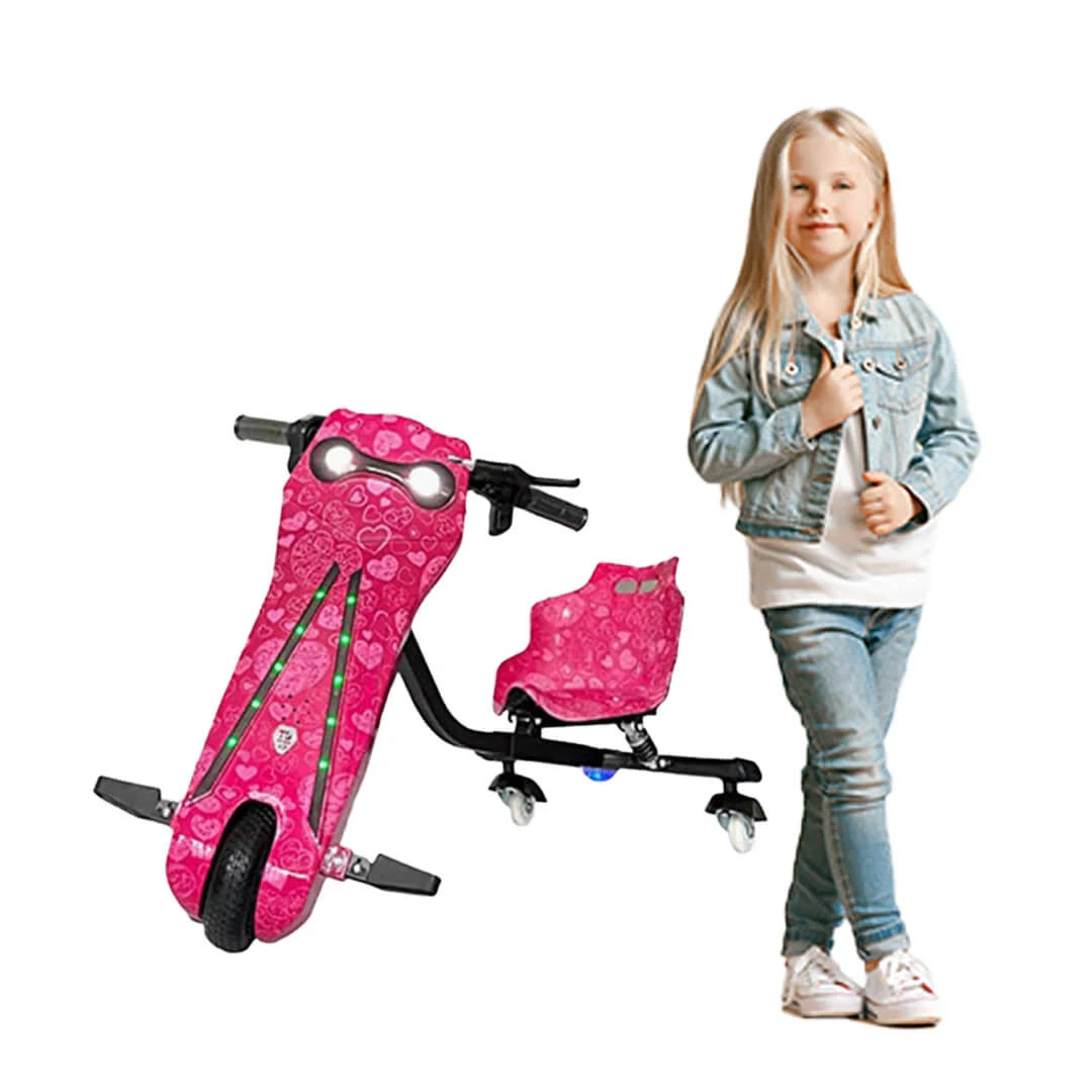 Pink scooter with heart designs and a child standing next to it on a white background