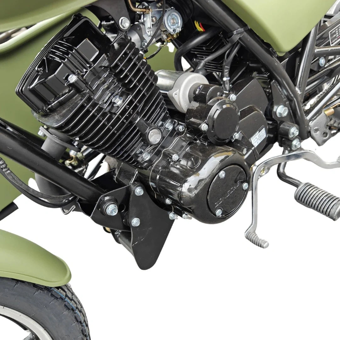 Close-up of a motorcycle engine with a green background
