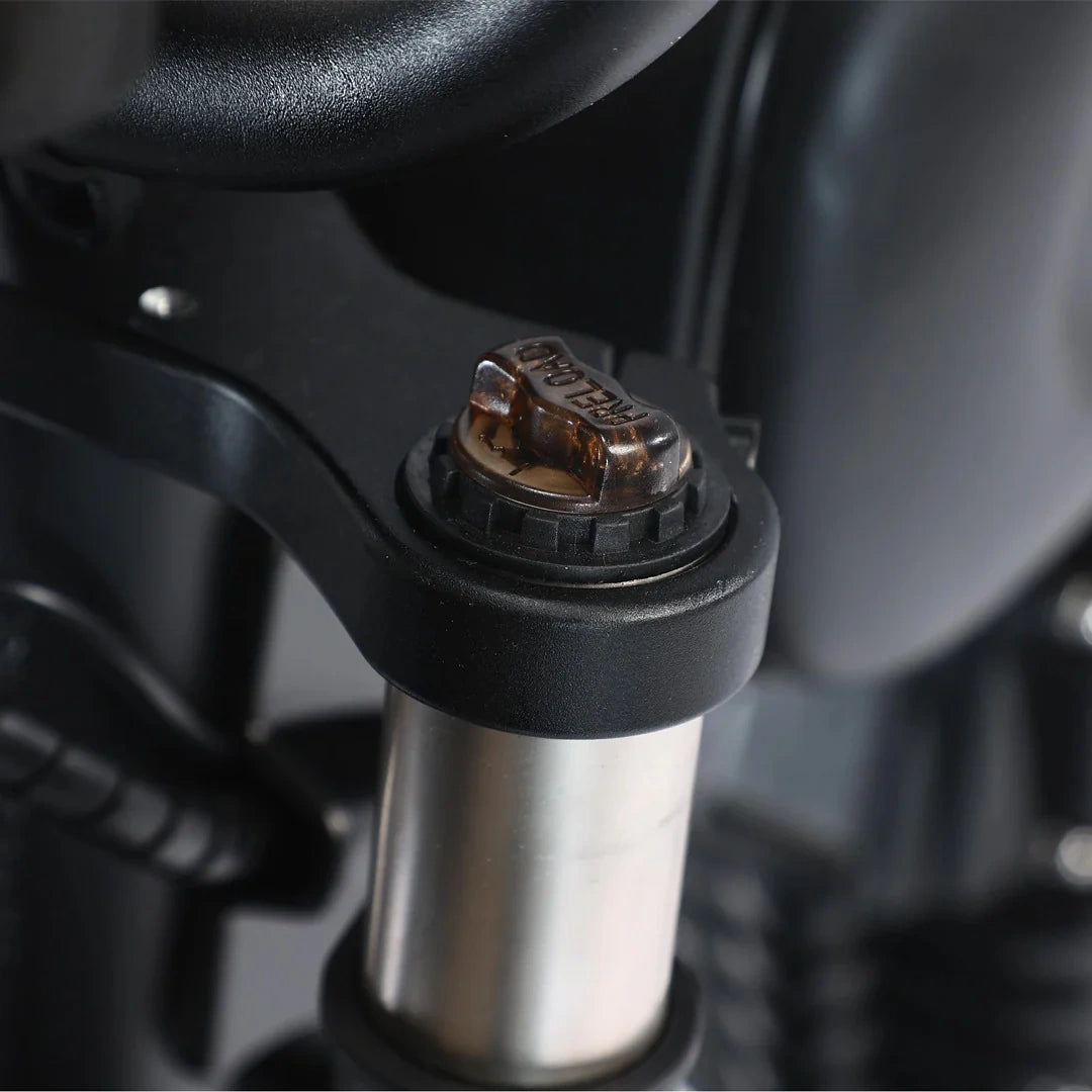 Close-up of a motorcycle suspension fork with brand logo