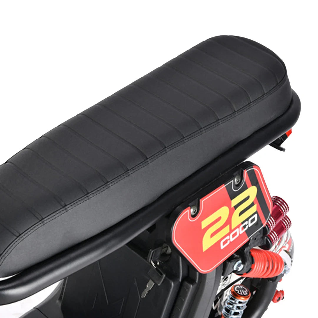Close-up of a motorcycle seat with a visible brand logo on a white background