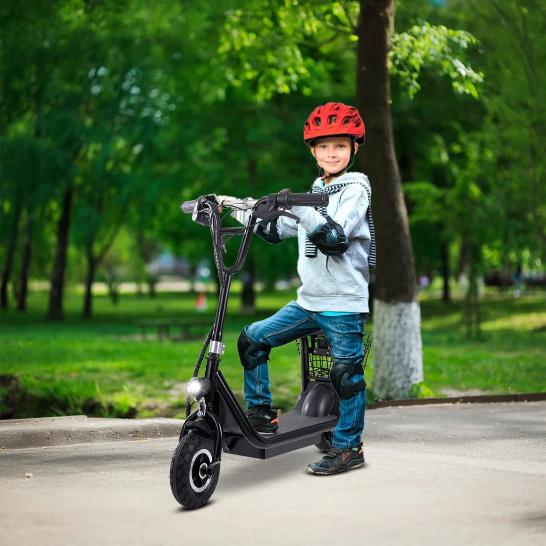 Child riding a black electric scooter in a park