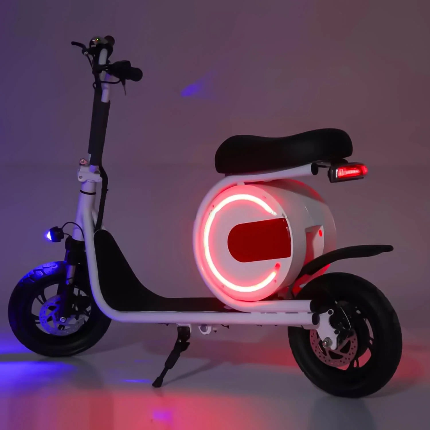 Electric scooter with glowing red light on a dark background