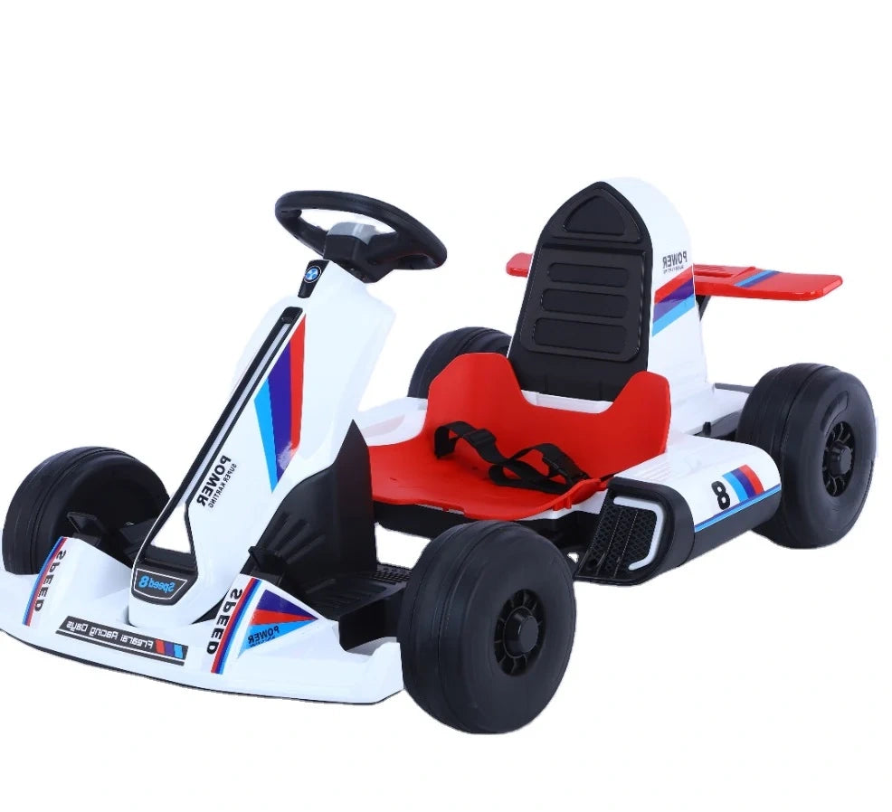 Children's go-kart with white body, red seat, and black wheels on a white background