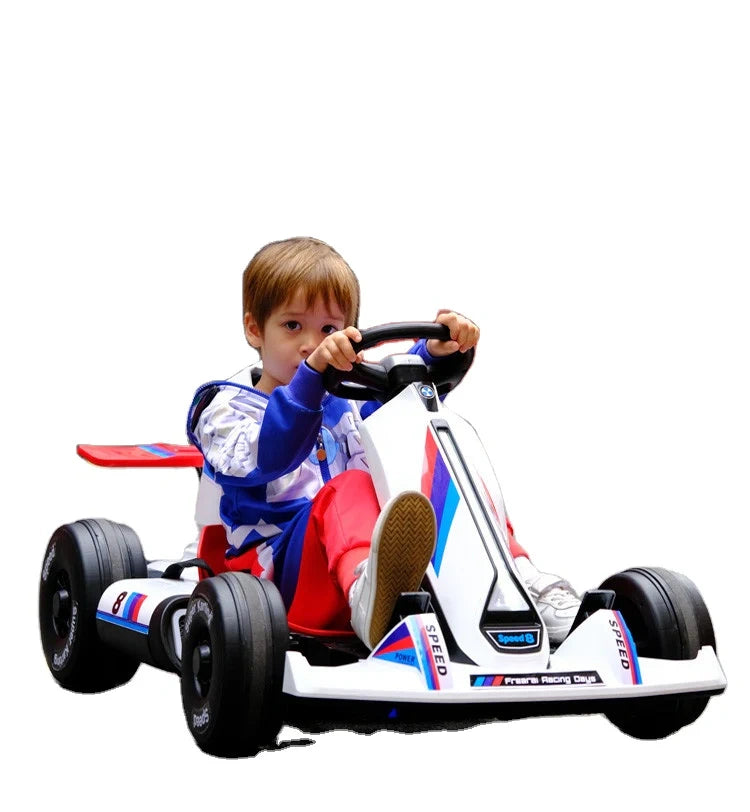 Child in a toy racing car with a white background