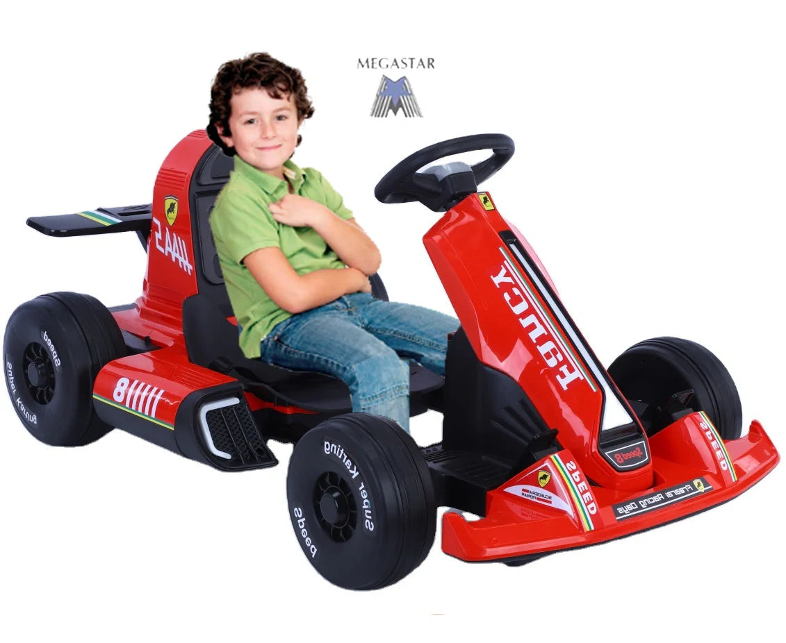 Child sitting in a red toy go-kart with Ferrari branding on a white background