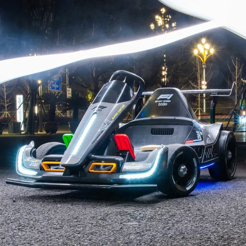High-performance go-kart on a track at night with illuminated background