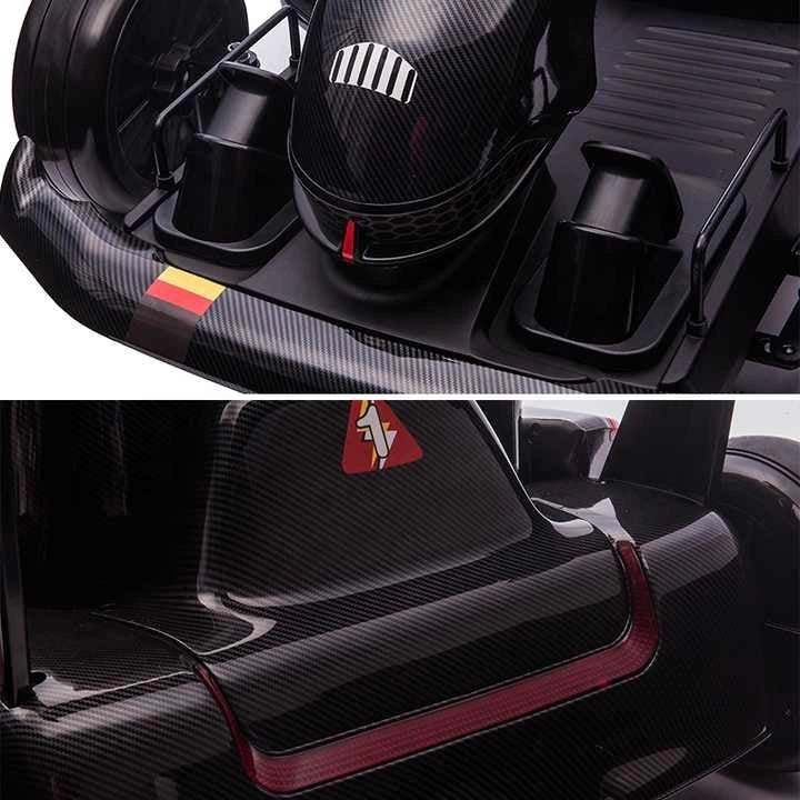 Carbon fiber car interior with cup holders and a red logo.