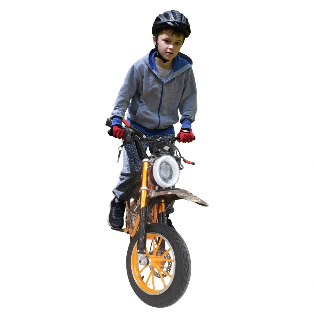 Child on a small motorcycle with orange wheels against a white background