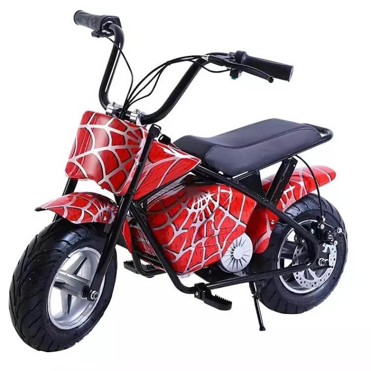 Red and black children's motorcycle with spider web design on a white background