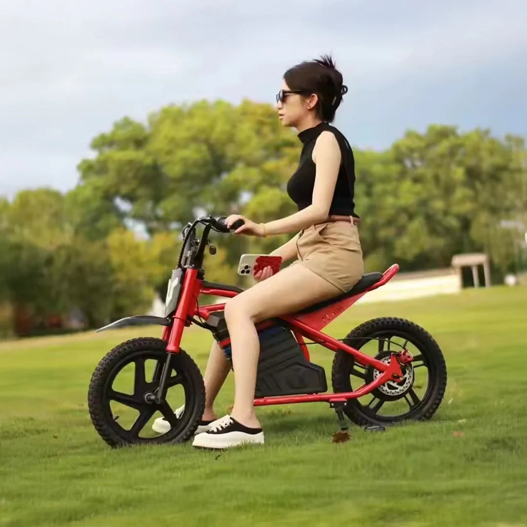 Woman riding a red electric bike in a park