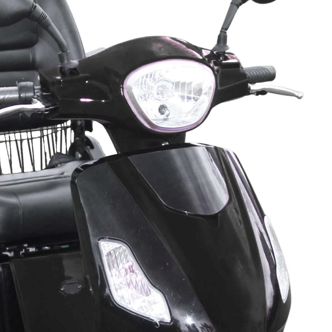Close-up of a black scooter with headlight and windshield on a white background