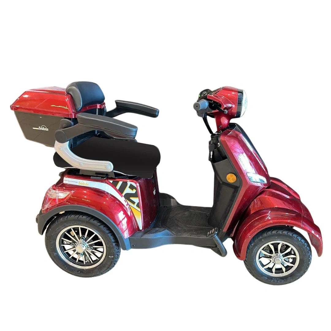 Red three-wheeled mobility scooter on a white background