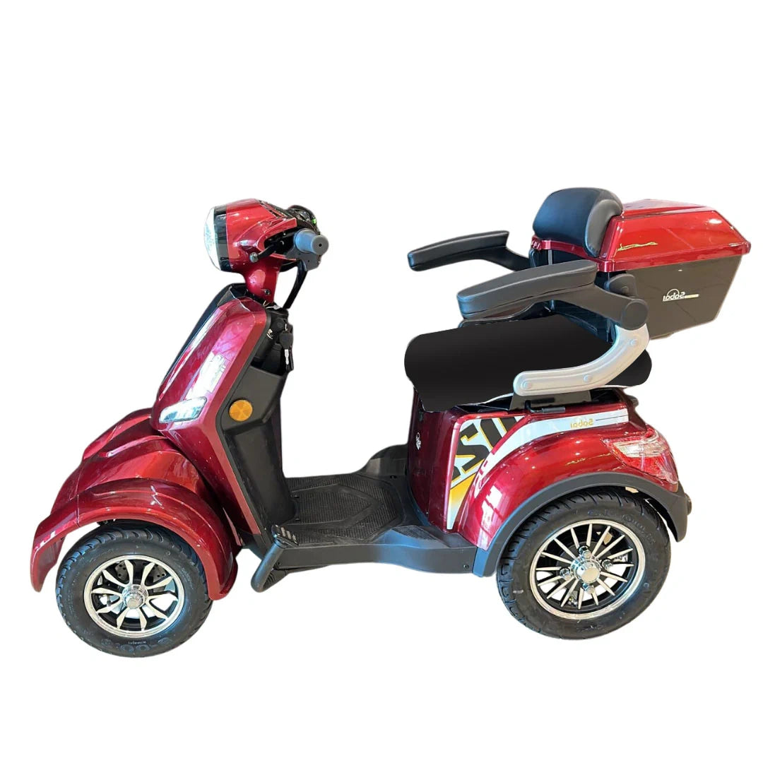 Red mobility scooter with a white background